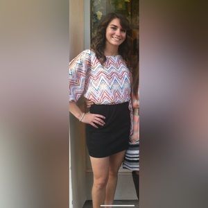 Form fitting dress with flowy top